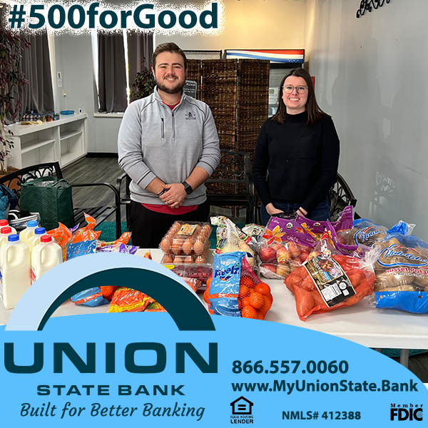 Union State Bank's Chief Credit Officer, Brittany Welch, presents fresh fruit, veggies, and other goods for the food pantry, along with a financial donation in support of SoShine Foundation's after school program to the foundation's Austin Lakey.