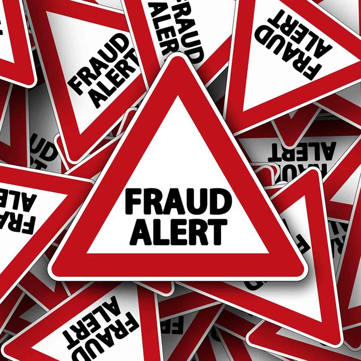Image of a pile of various sized caution triangles that read "Fraud Alert". 