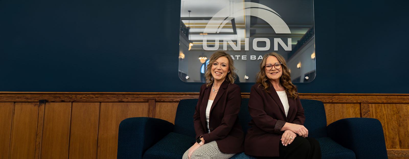 Photo of Amber Groene and Robinn Carr, members of Union State Bank's Treasury Management team.