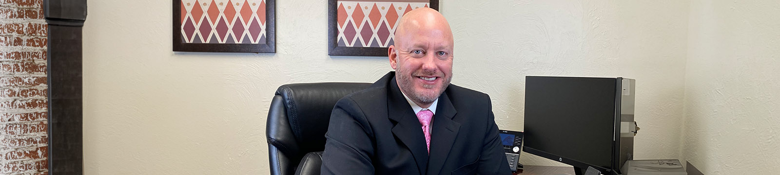 Photo of Zack Stoy, lender with Union State Bank, sitting at desk.